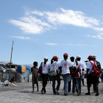 [British and Haitian Red Cross volunteers at La Piste camp]