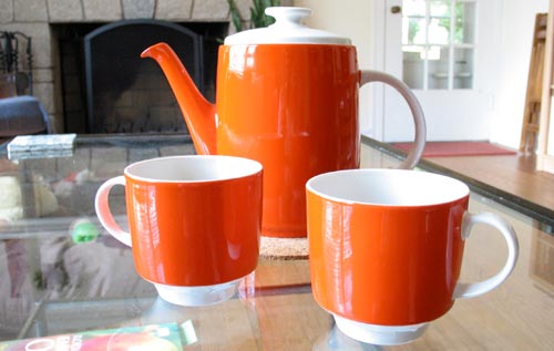 [red-orange coffee pot and cups]